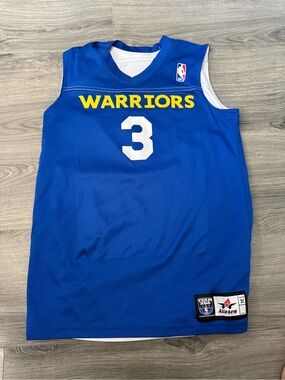 This is a blue and yellow youth-size Alleson Athletic Golden State Warriors #3